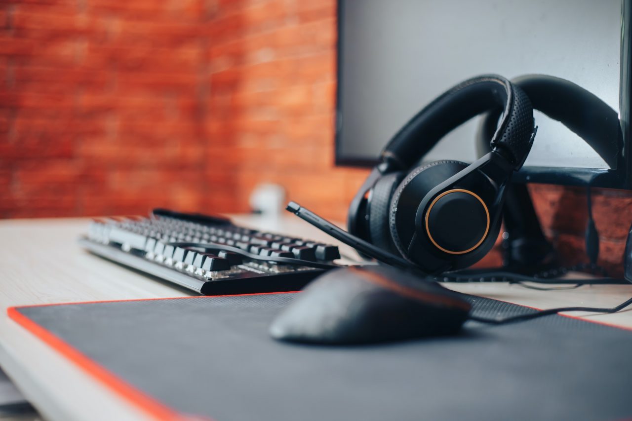 Gaming arena background with mouse gear headphones computer, focuse on headphones selected focuse