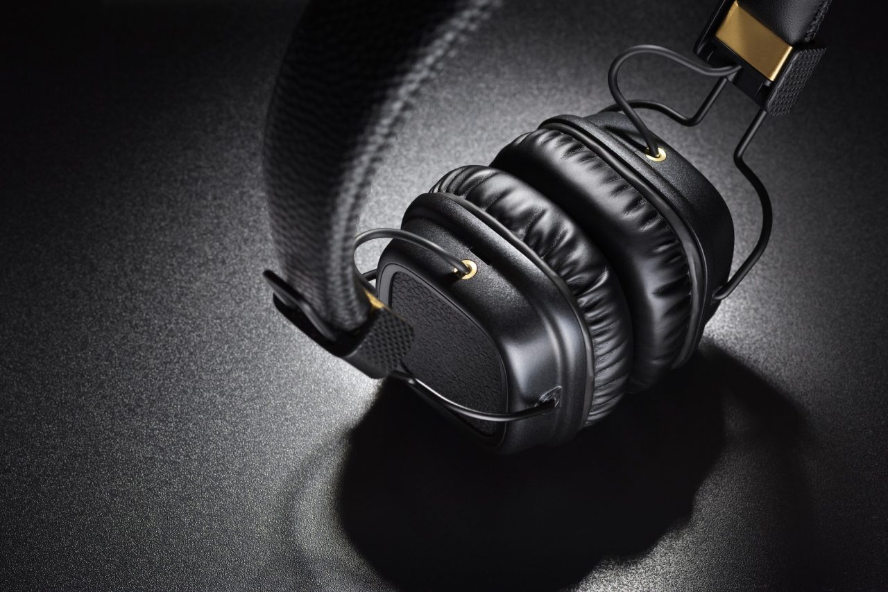 Wireless on-ear headphones on black background